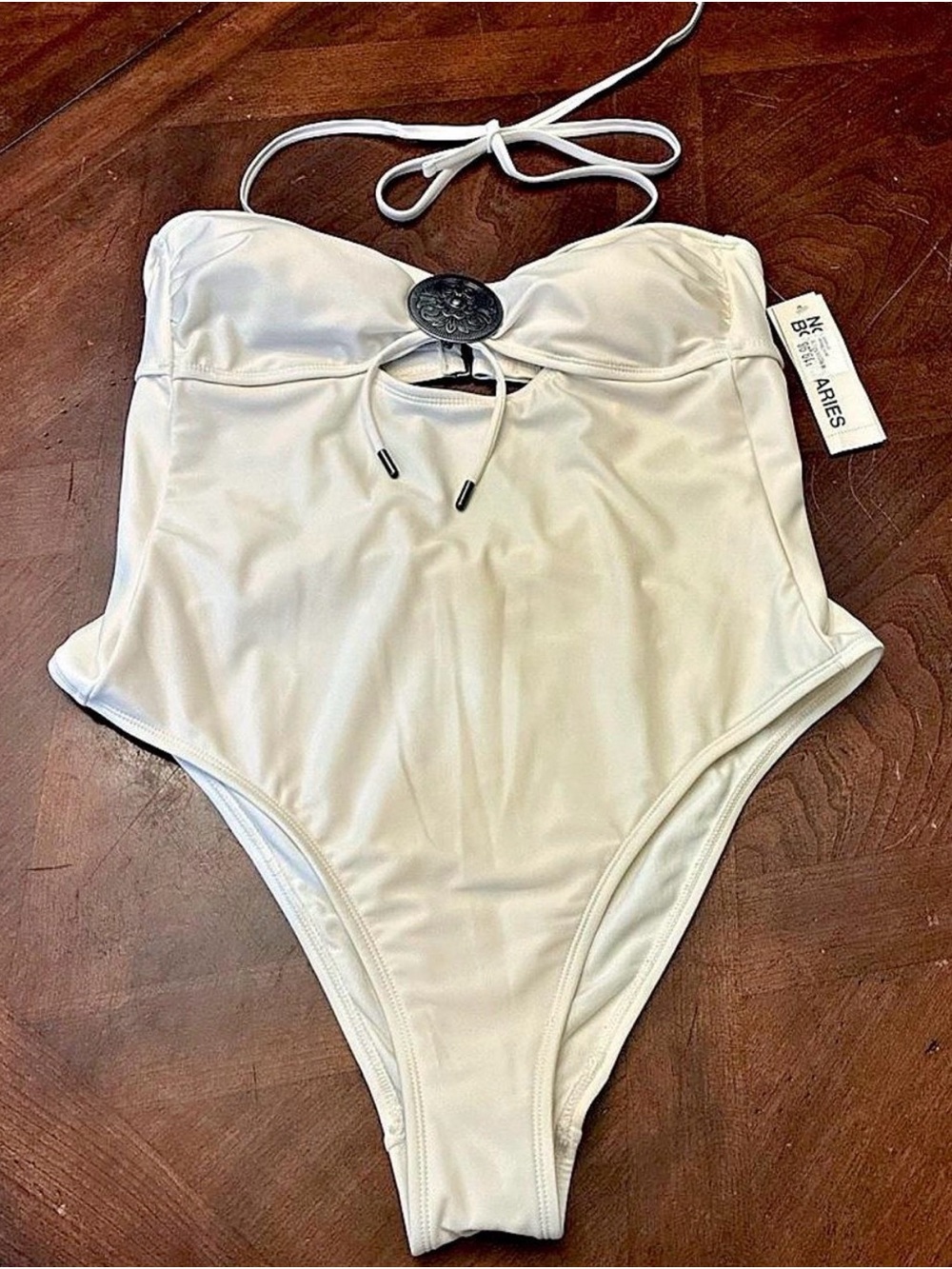 No Boundaries White Strapless One-Piece Swimsuit with Decorative Medallion
